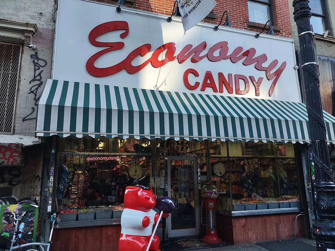 Economy Candy storefront with its red script sign and striped awning