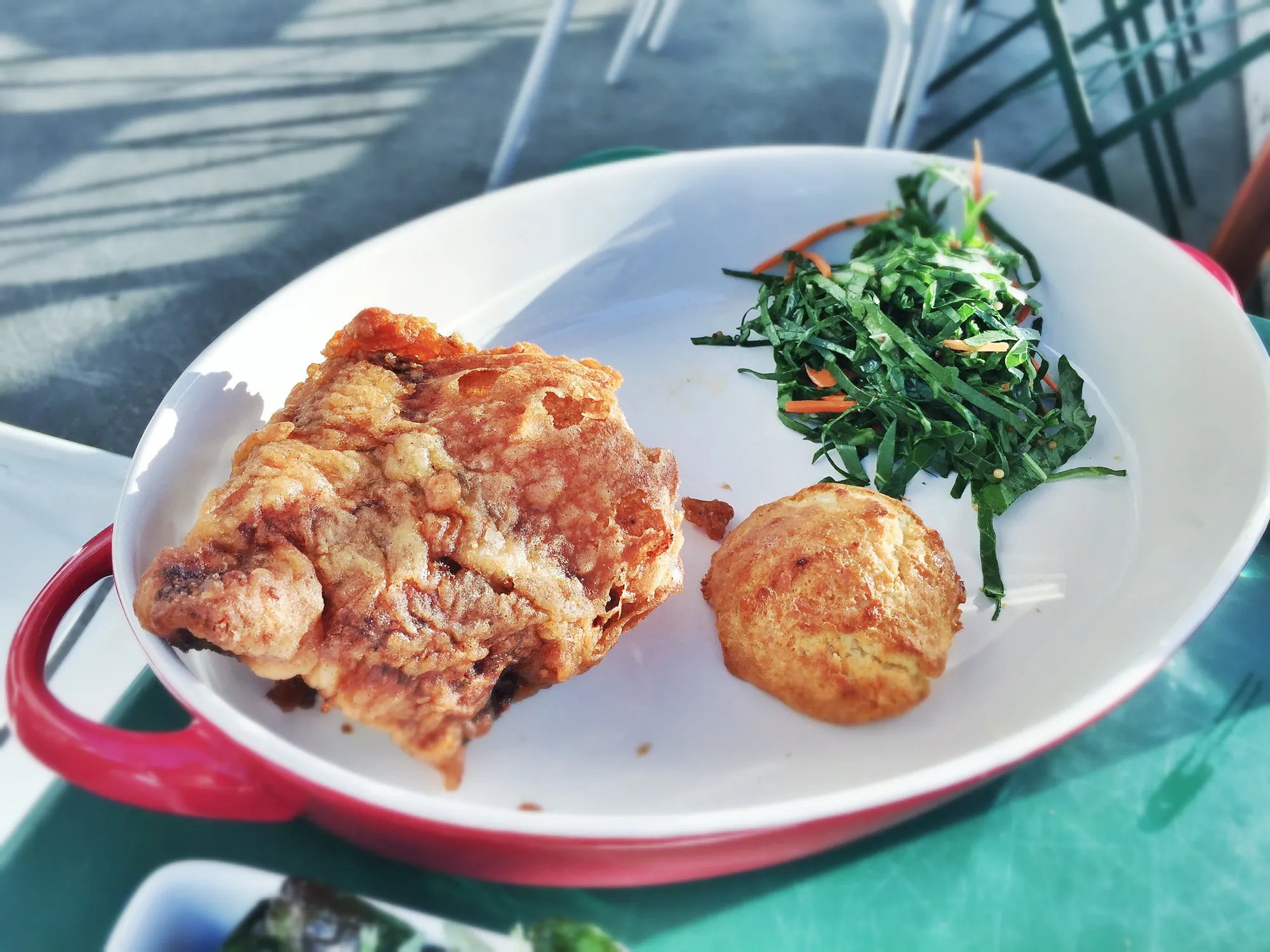 Fried chicken with a biscuit and collard greens