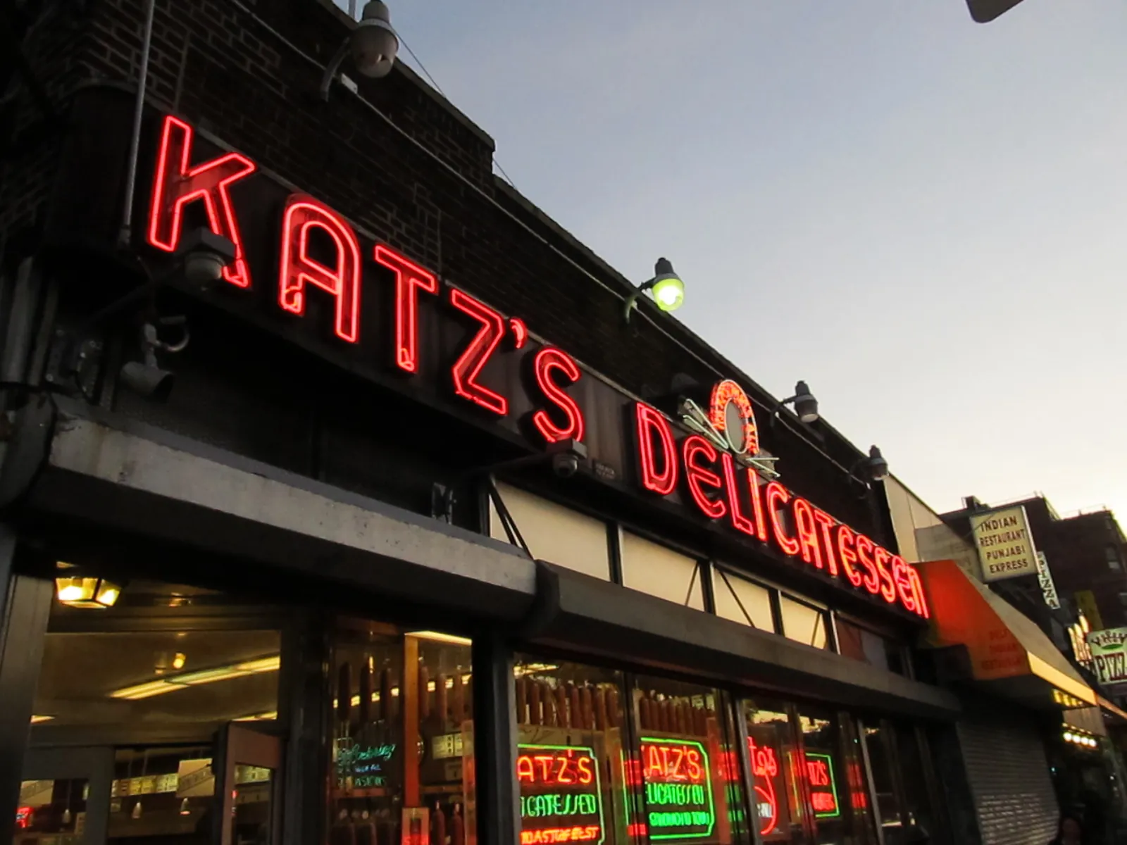 Katz's Delicatessen neon sign at dusk