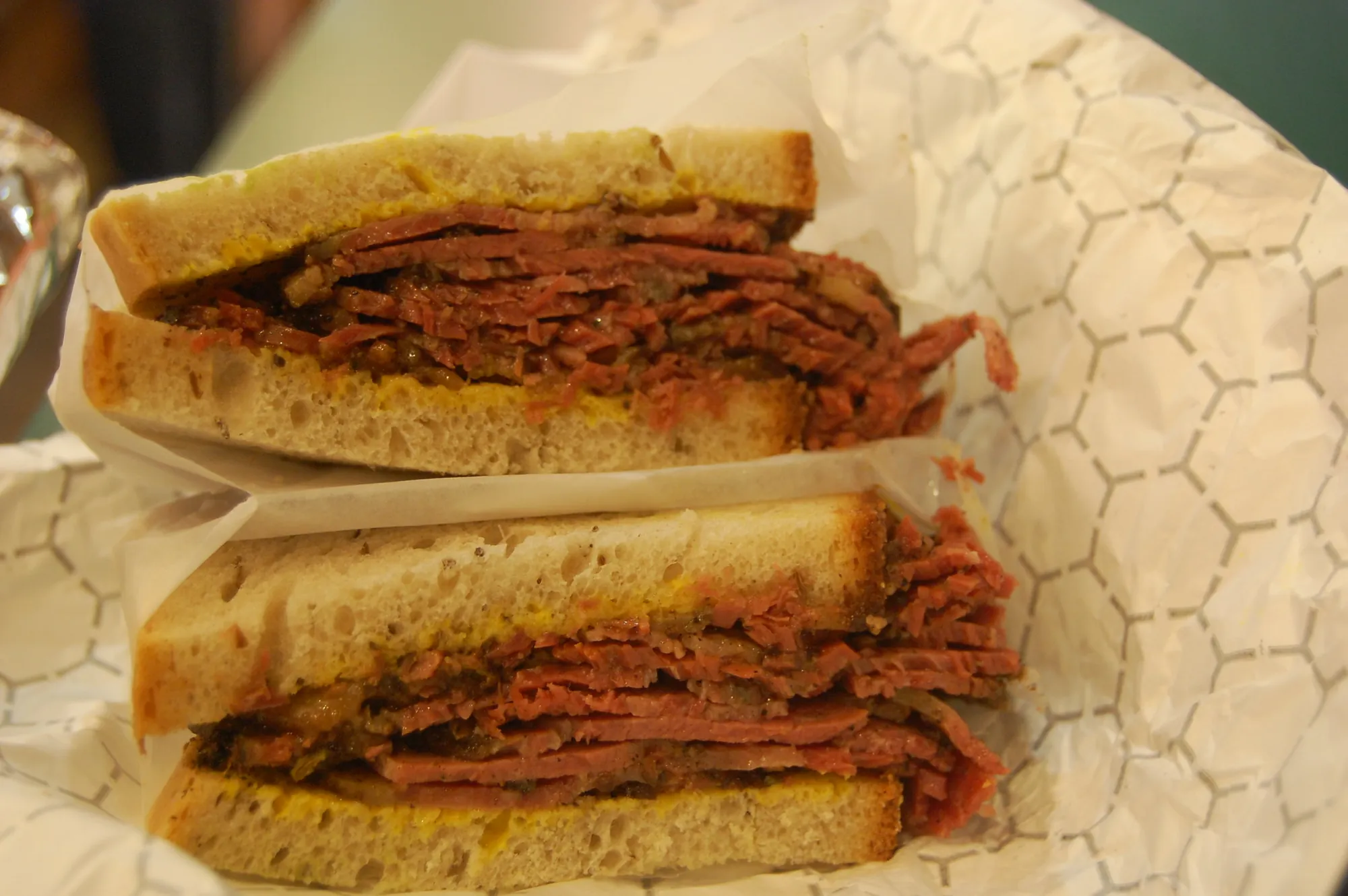 A pastrami sandwich on rye bread