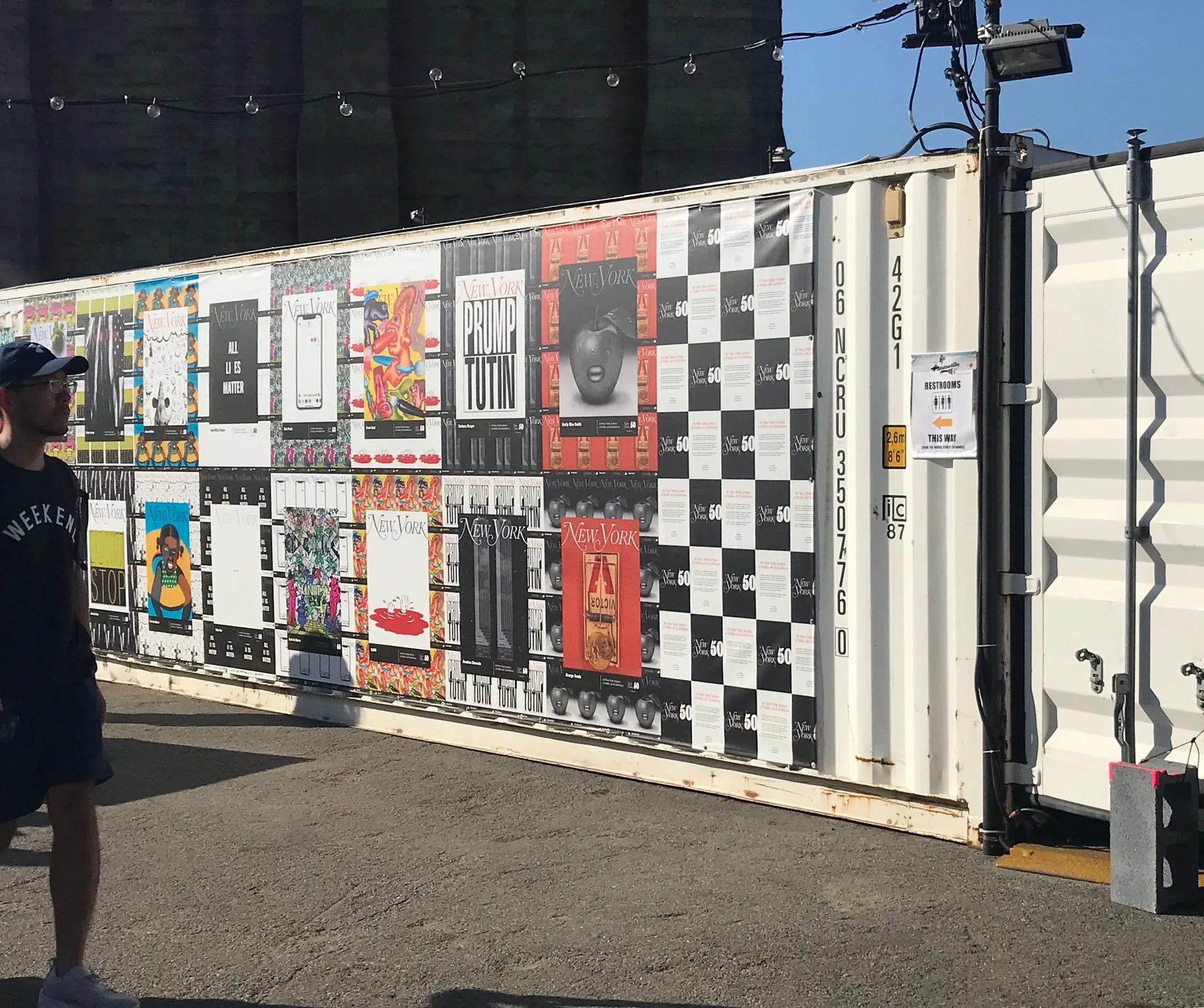 Photographs displayed on a shipping container at Photoville